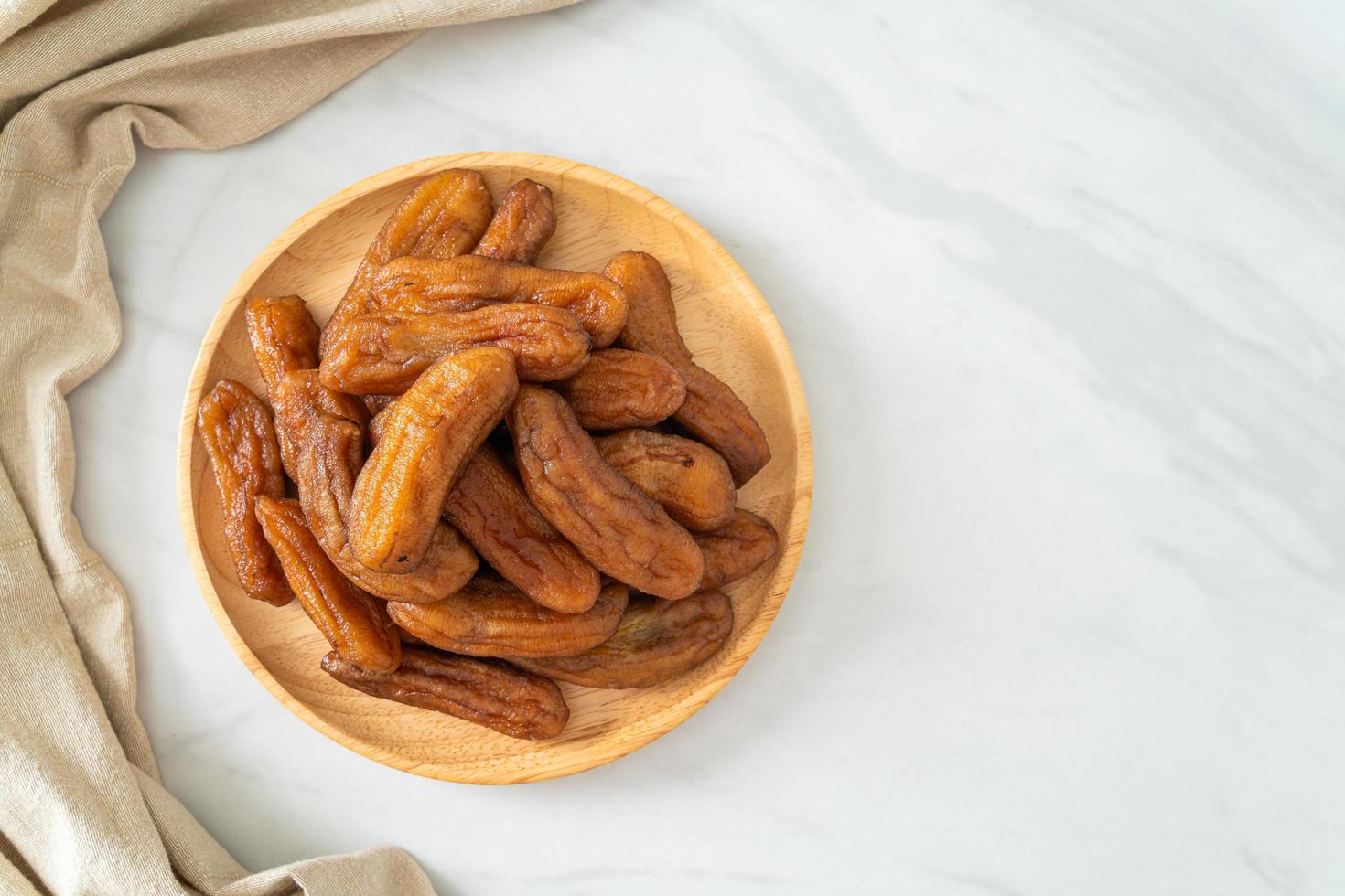 sun dried banana on plate photo