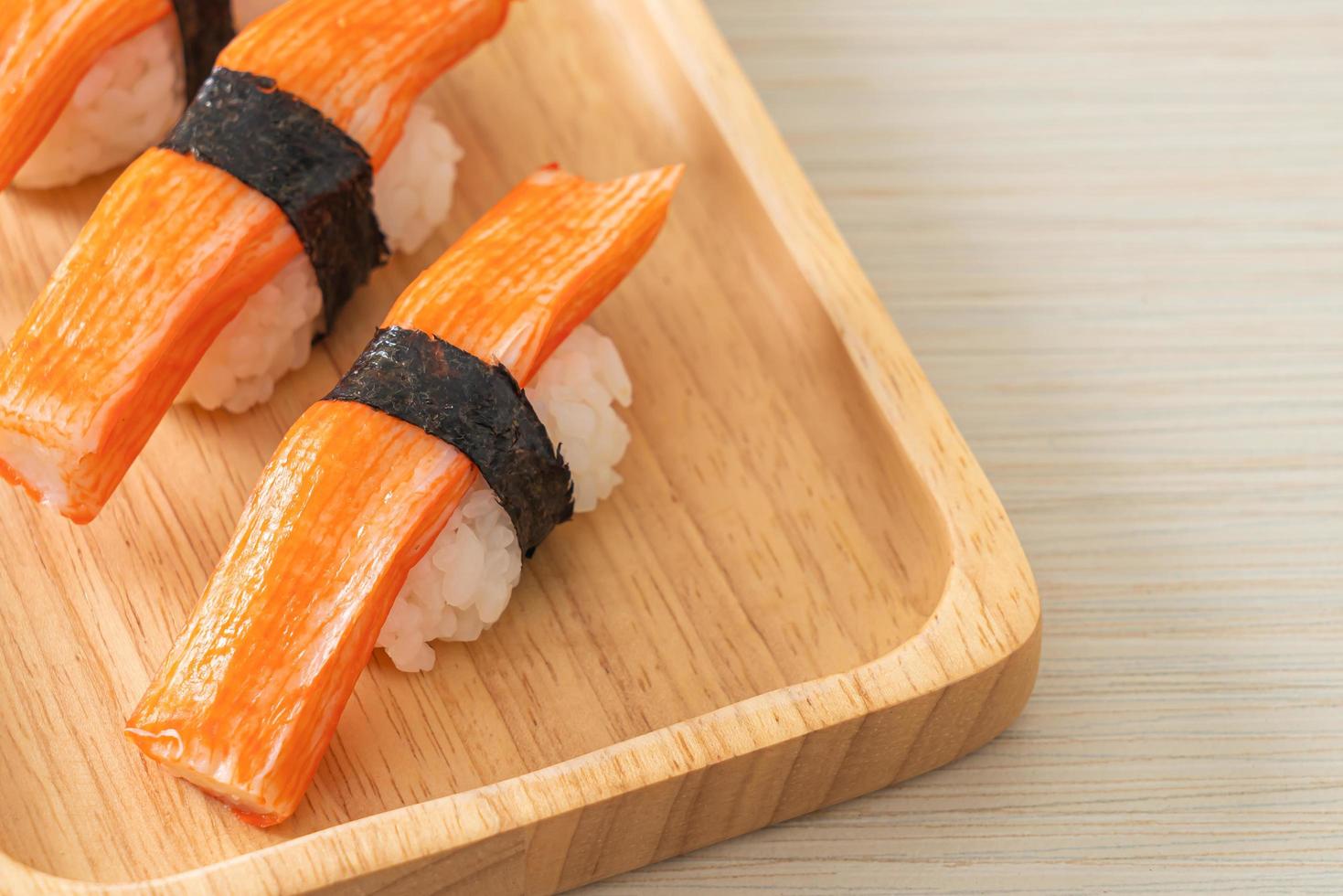 Crab Stick Sushi on wood plate photo