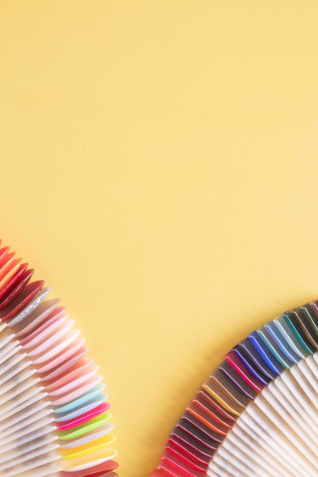 Flat lay manicure tools on a colored background with copy space photo