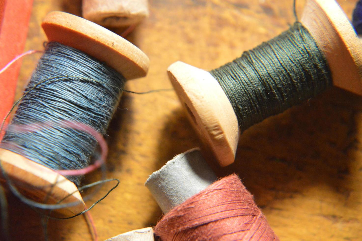 Spools of thread for sewing clothes close-up photo