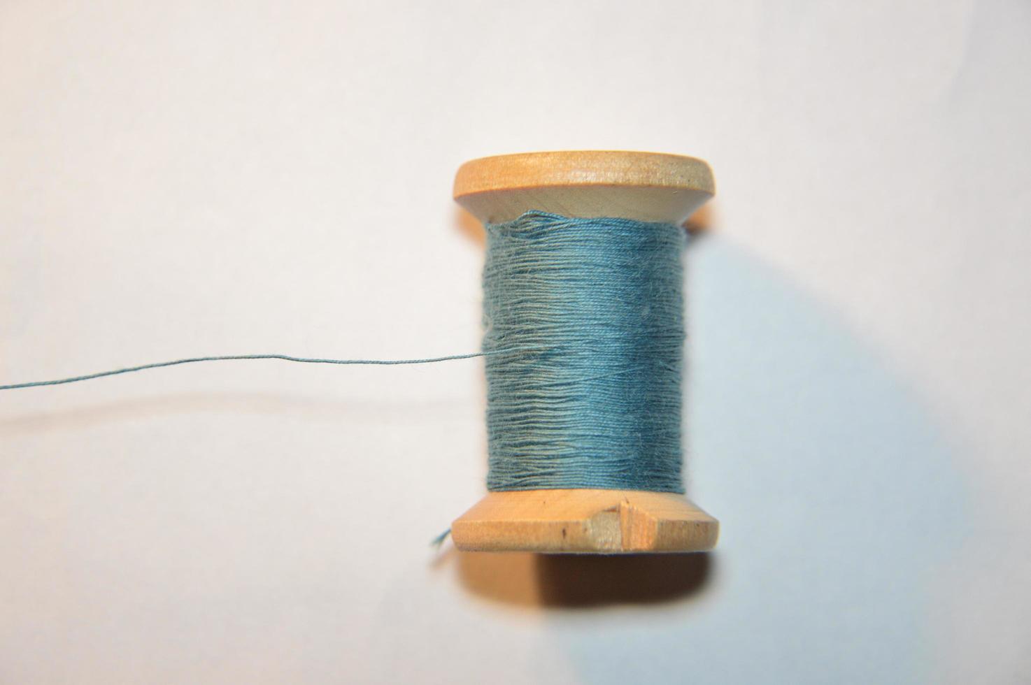 Spools of thread for sewing clothes close-up photo