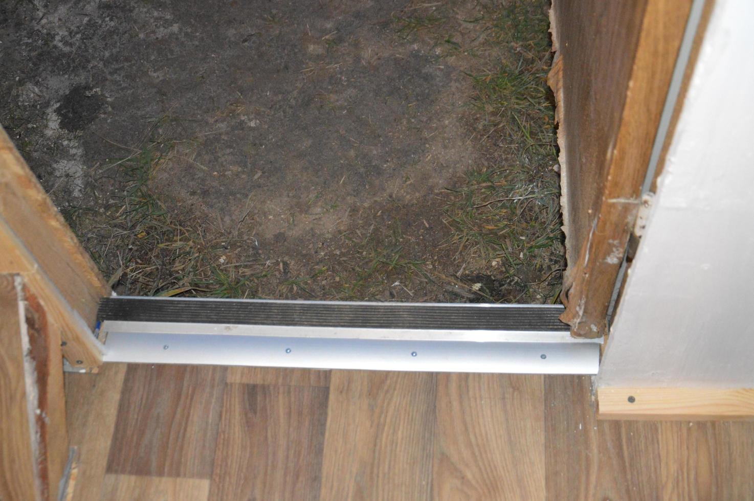 Installation of floor skirting boards on the floor and linoleum photo