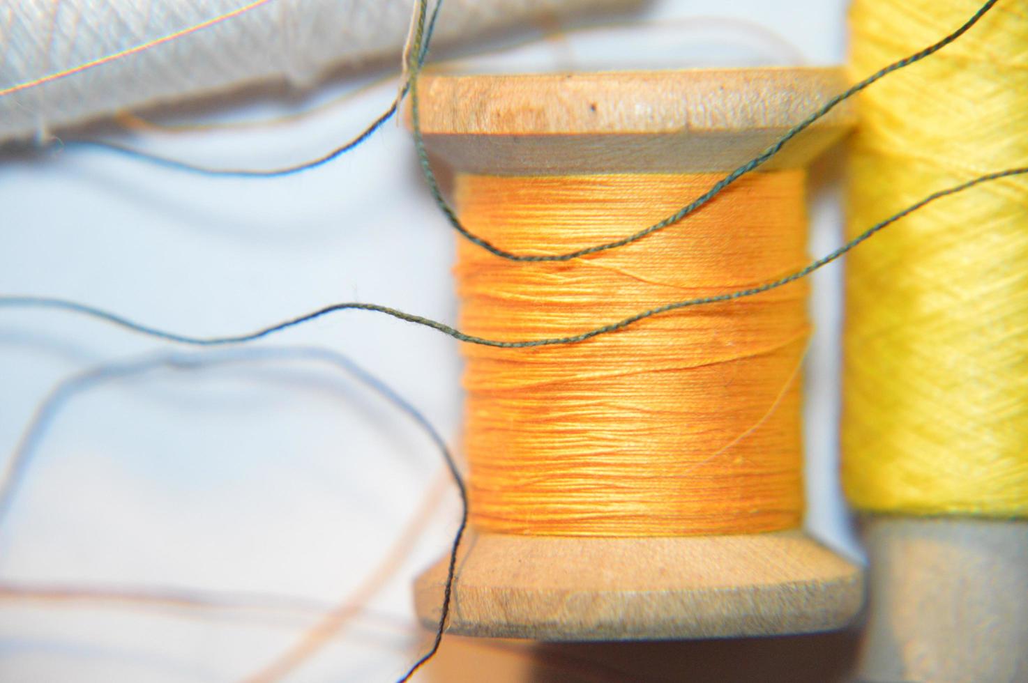 Spools of thread for sewing clothes close-up photo