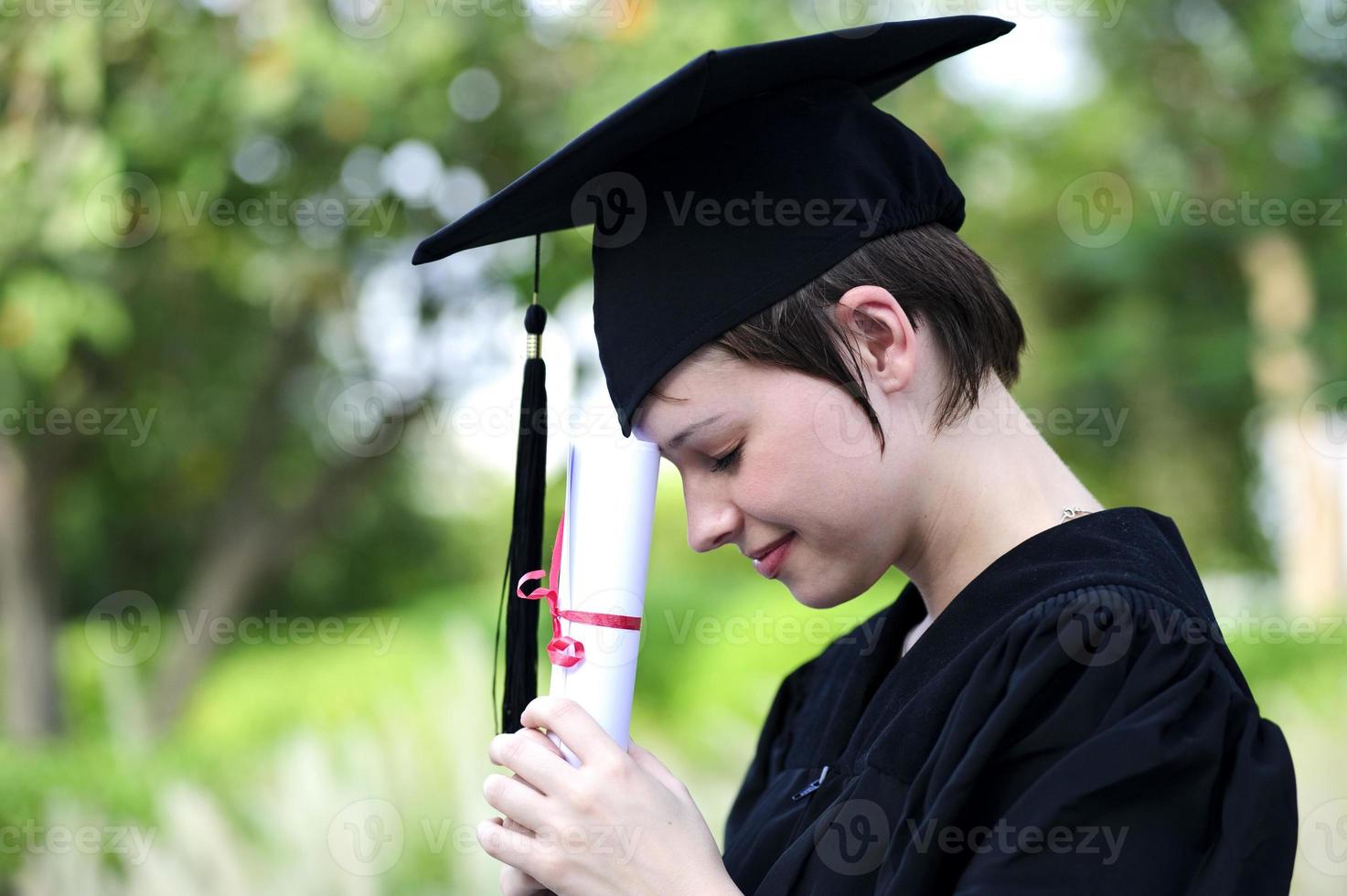 Happy woman portrait on her graduation day smiling photo