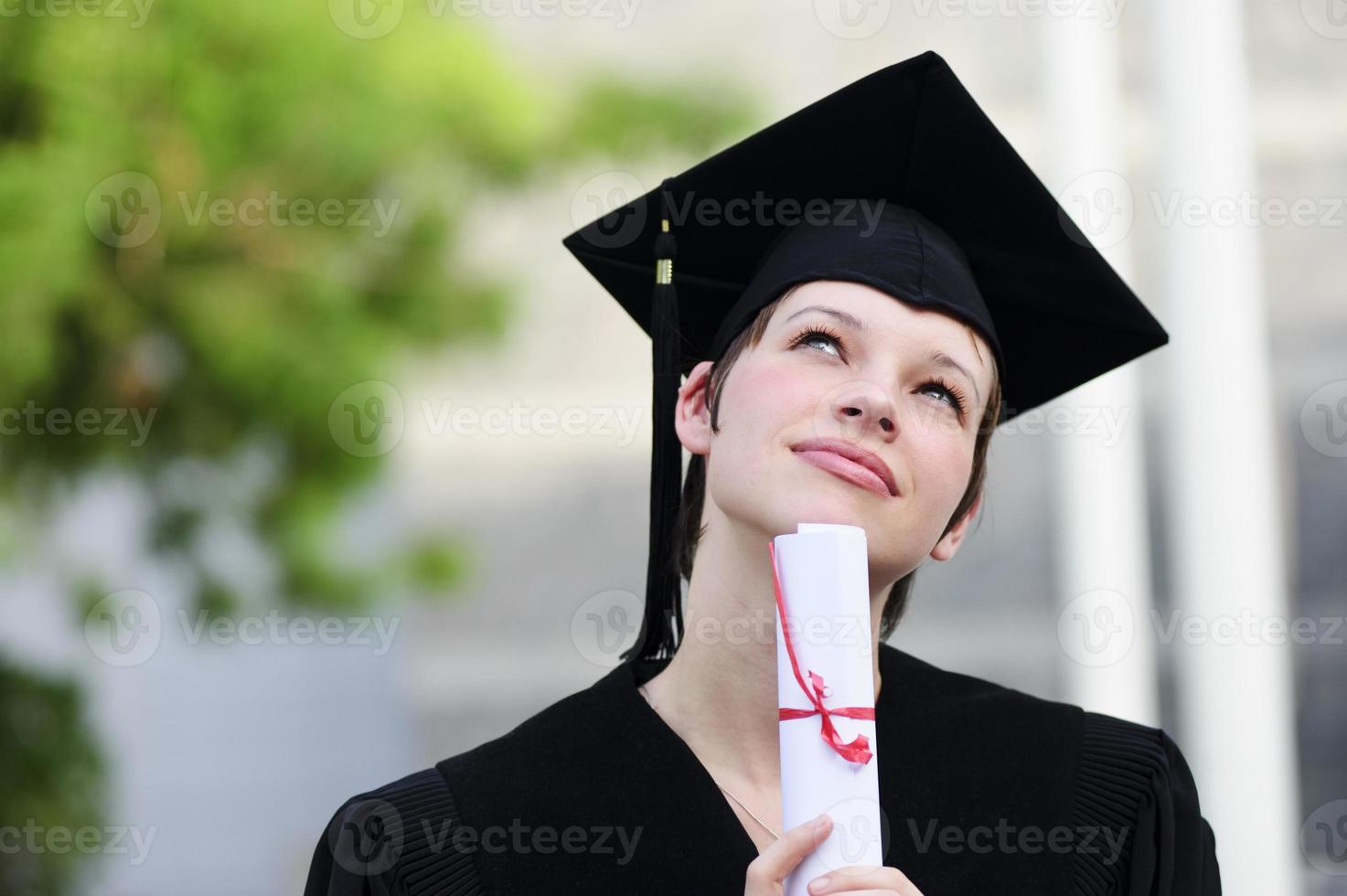 Happy woman portrait on her graduation day smiling photo