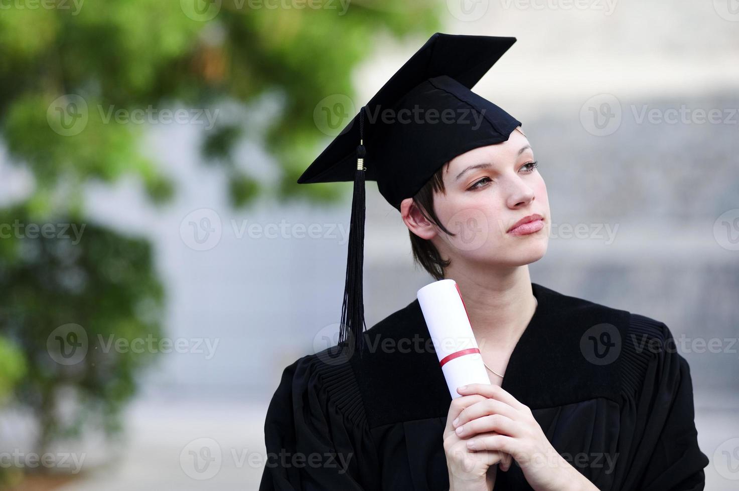 Happy woman portrait on her graduation day smiling photo