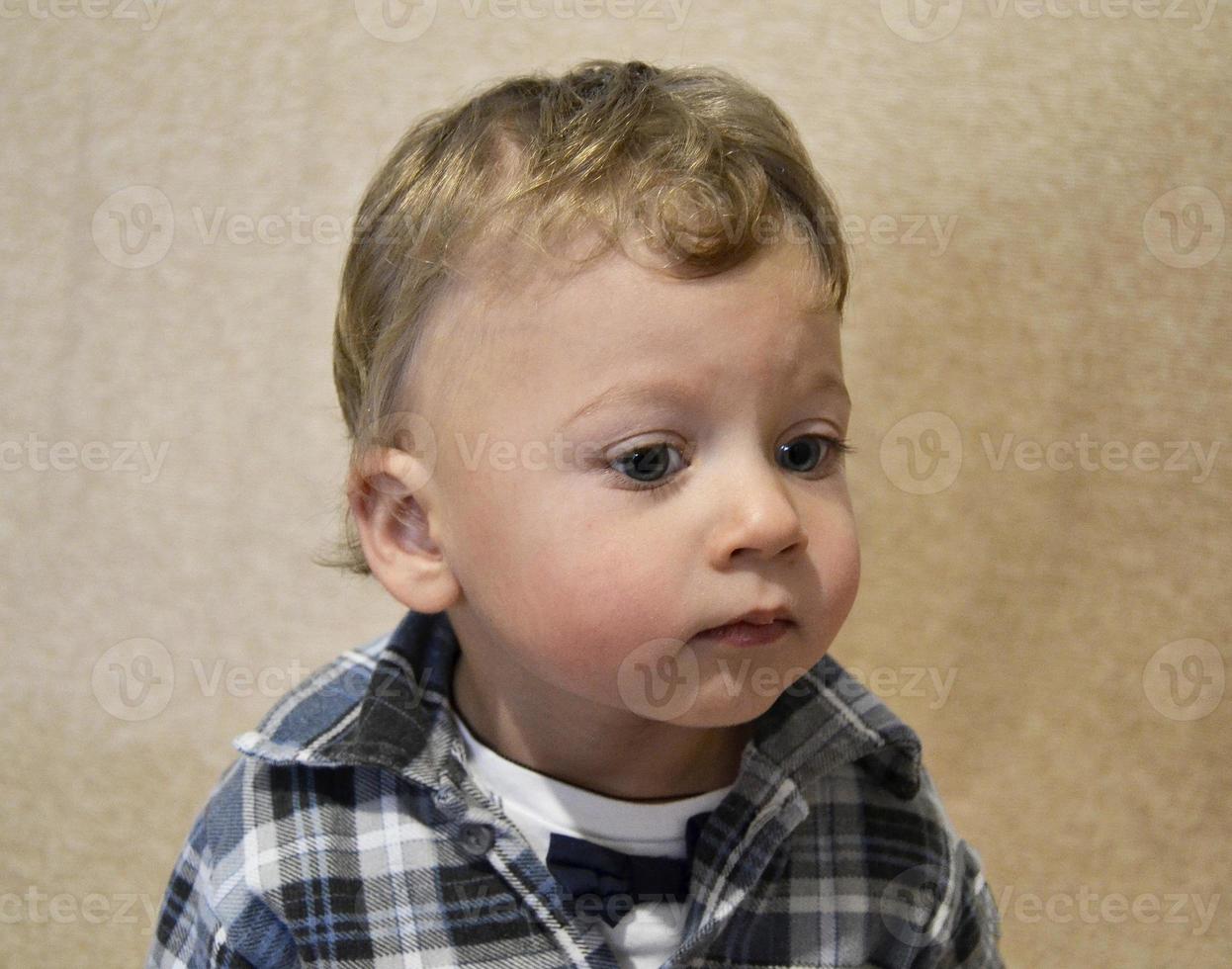 Beautiful baby boy with child face posing photographer photo