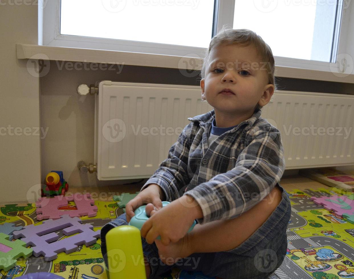 Beautiful baby boy with child face posing photographer photo