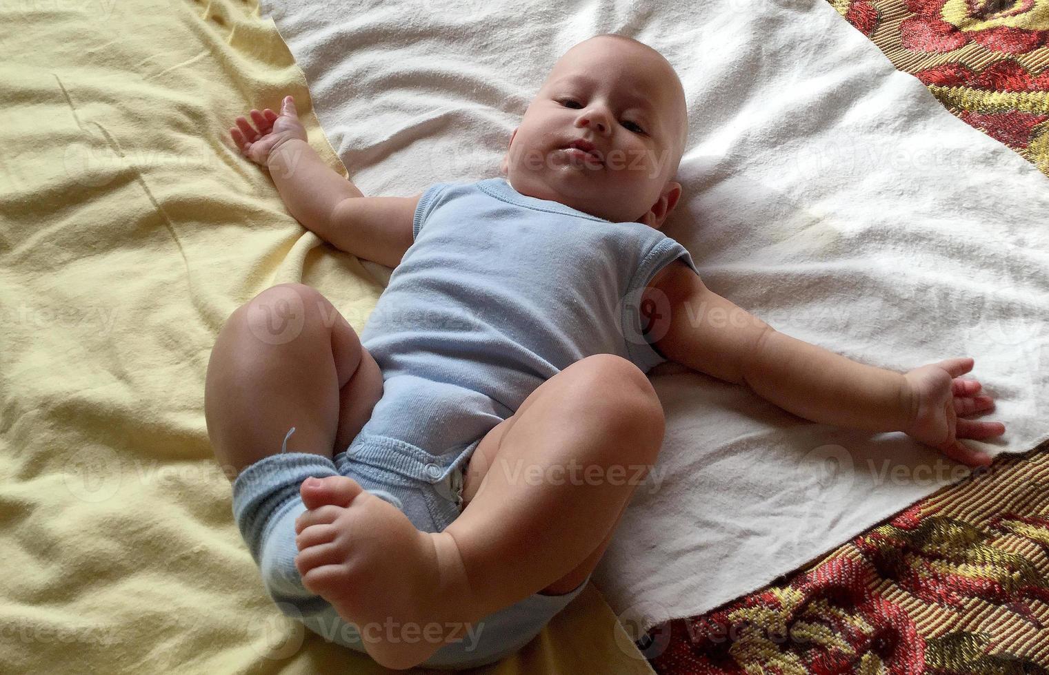 Beautiful baby boy with child face posing photographer photo