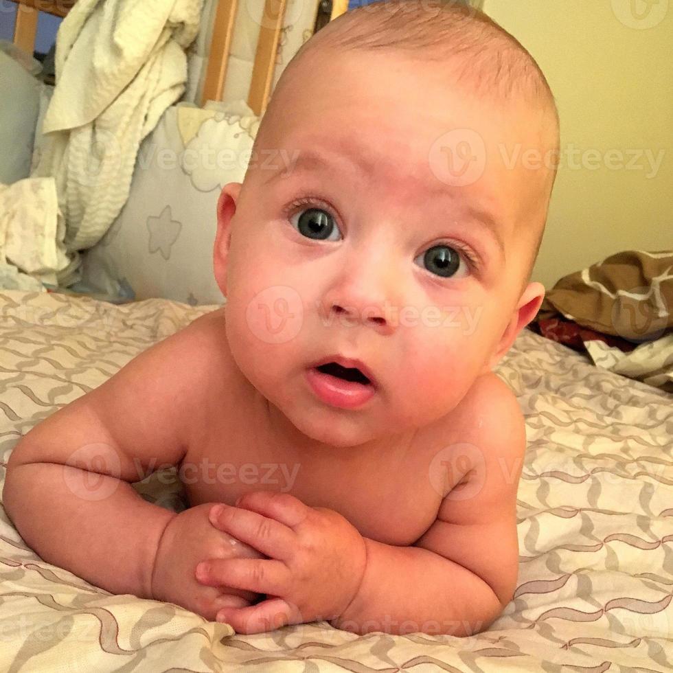 Beautiful baby boy with child face posing photographer photo