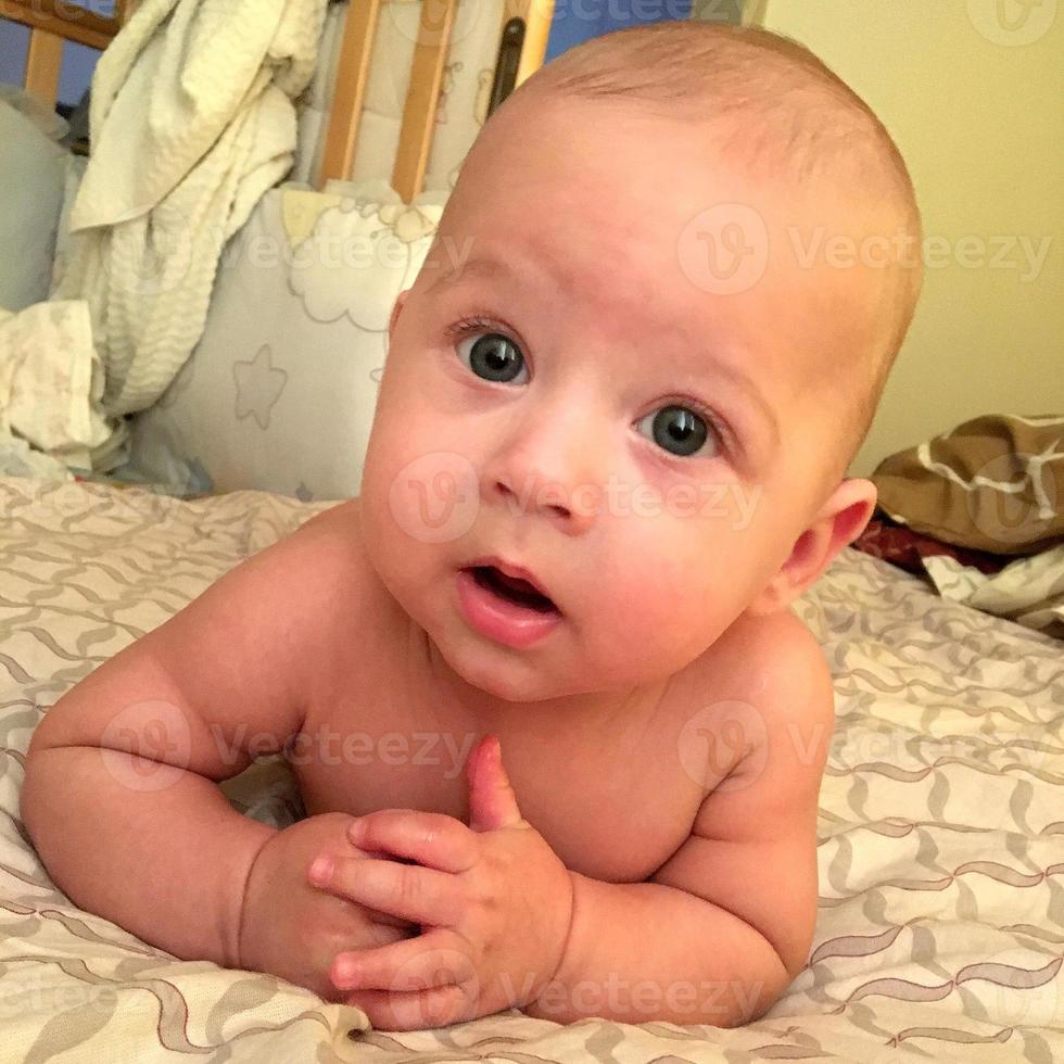 Beautiful baby boy with child face posing photographer photo