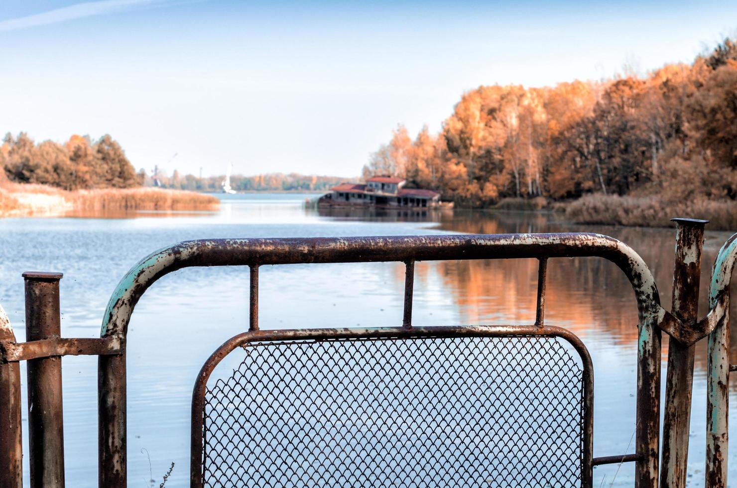 Pripyat, Ukraine, 2021 - Fence near river in Chernobyl photo