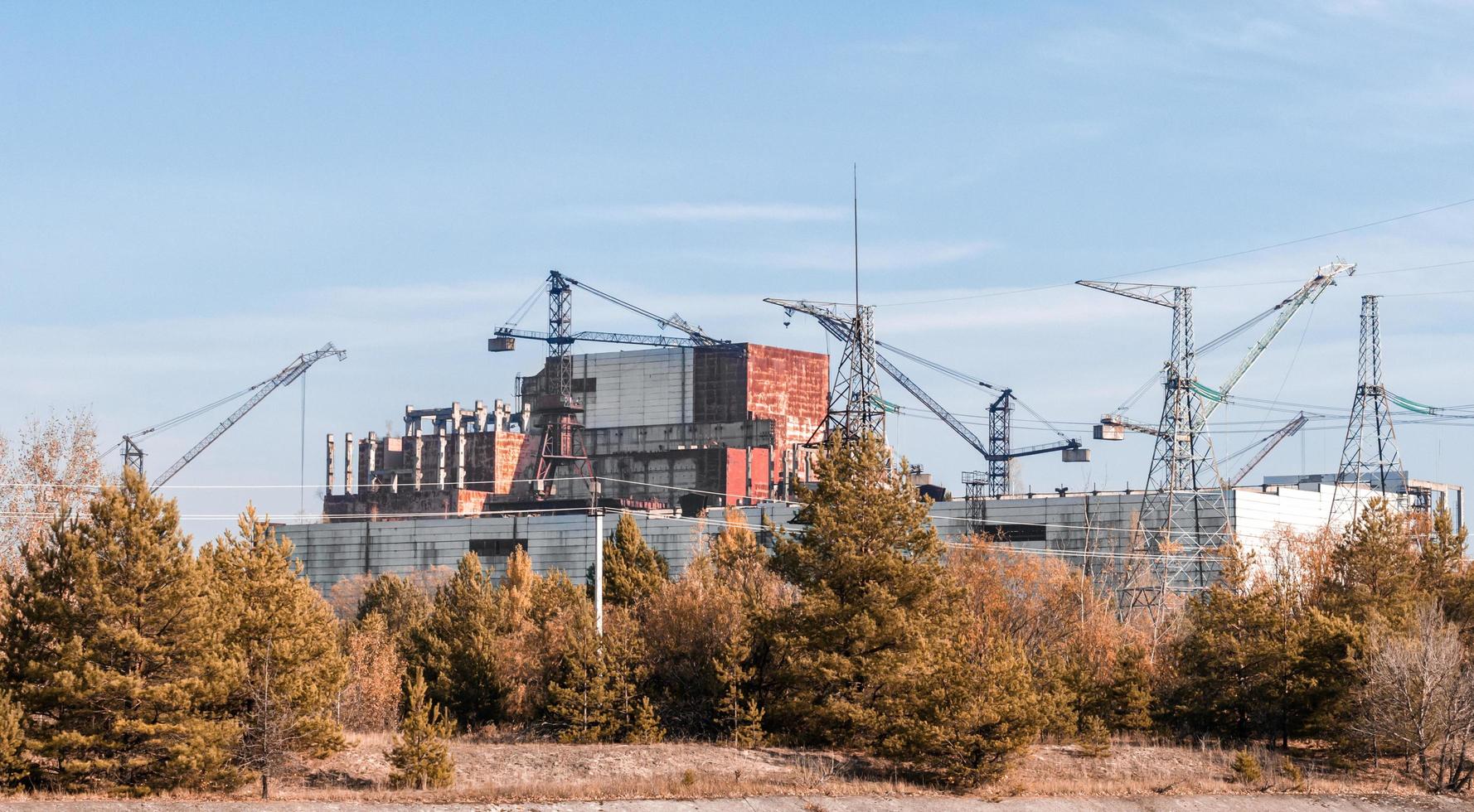 Pripyat, Ukraine, 2021 - Construction cranes in Chernobyl photo