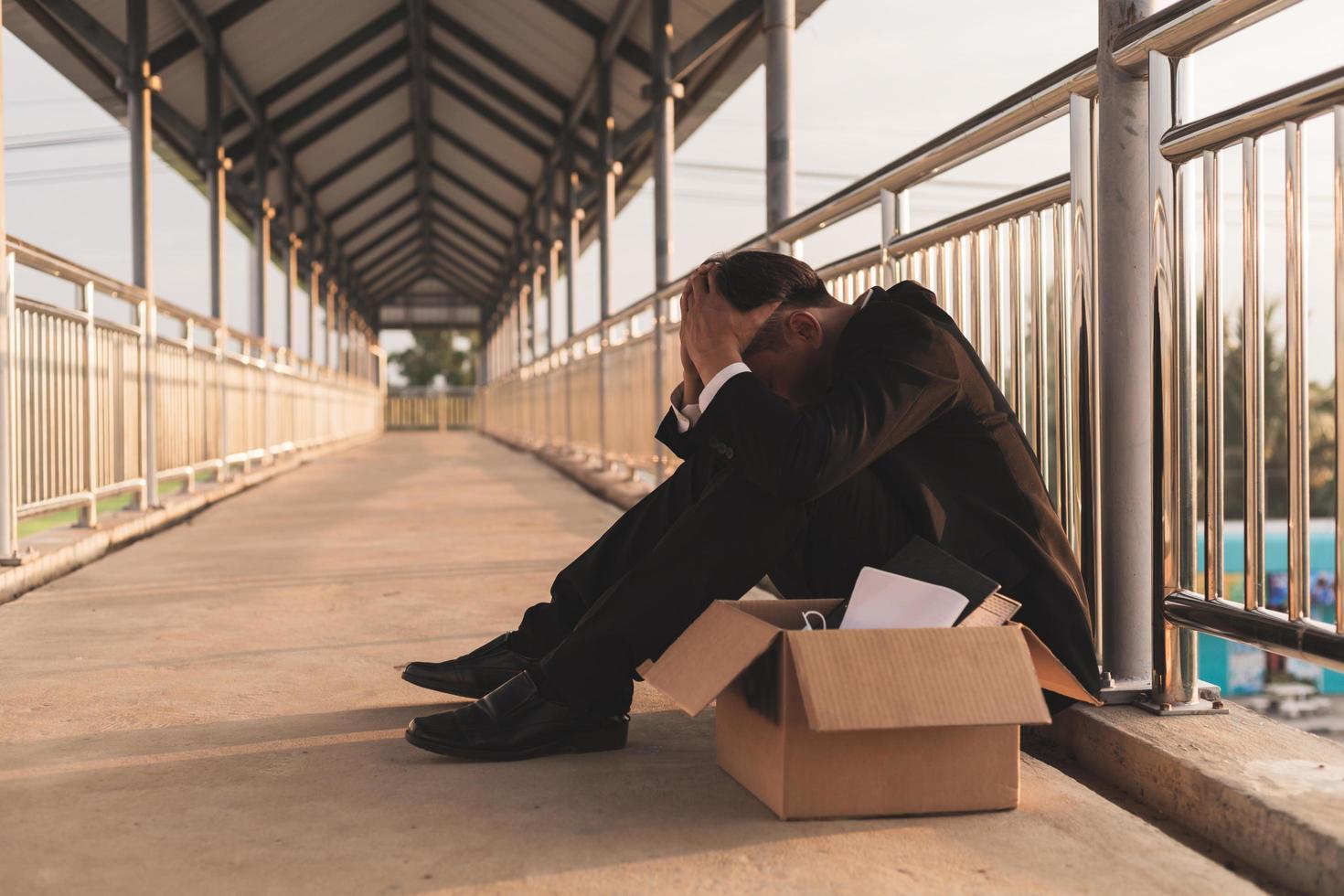 Sad Asian businessman losing job photo