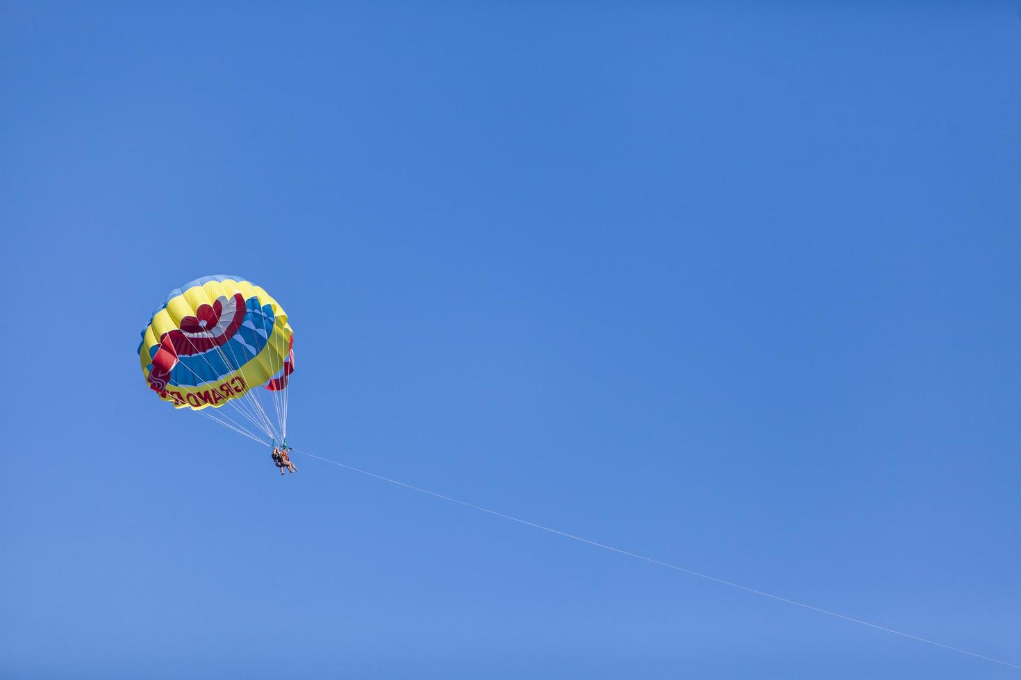 BELDIBI, TURKEY, OCTOBER 7 - Unidentified people parasailing at Beldibi at October 7, 2013. Parasailing is popular on the coastal area of Turkey and almost all main hotels has parasailing activity. photo