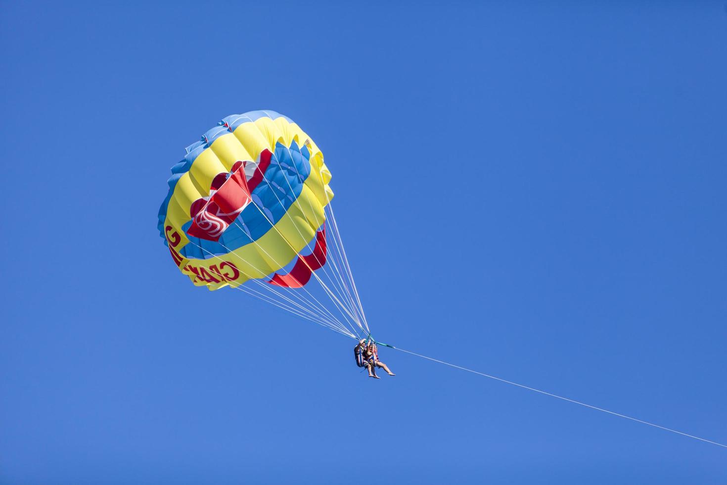 BELDIBI, TURKEY, OCTOBER 7 - Unidentified people parasailing at Beldibi at October 7, 2013. Parasailing is popular on the coastal area of Turkey and almost all main hotels has parasailing activity. photo