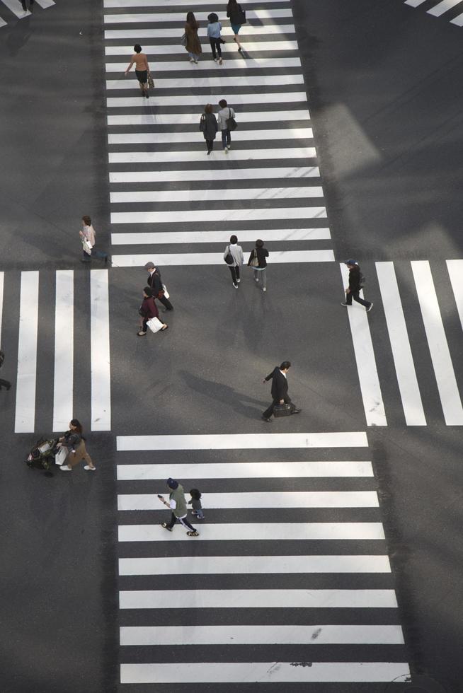 TOKYO, JAPAN, OCTOBER 12, 2016 - Unidentified people crossing the busy street in Ginza, Tokyo.It is a popular upscale shopping area of Tokyo. photo