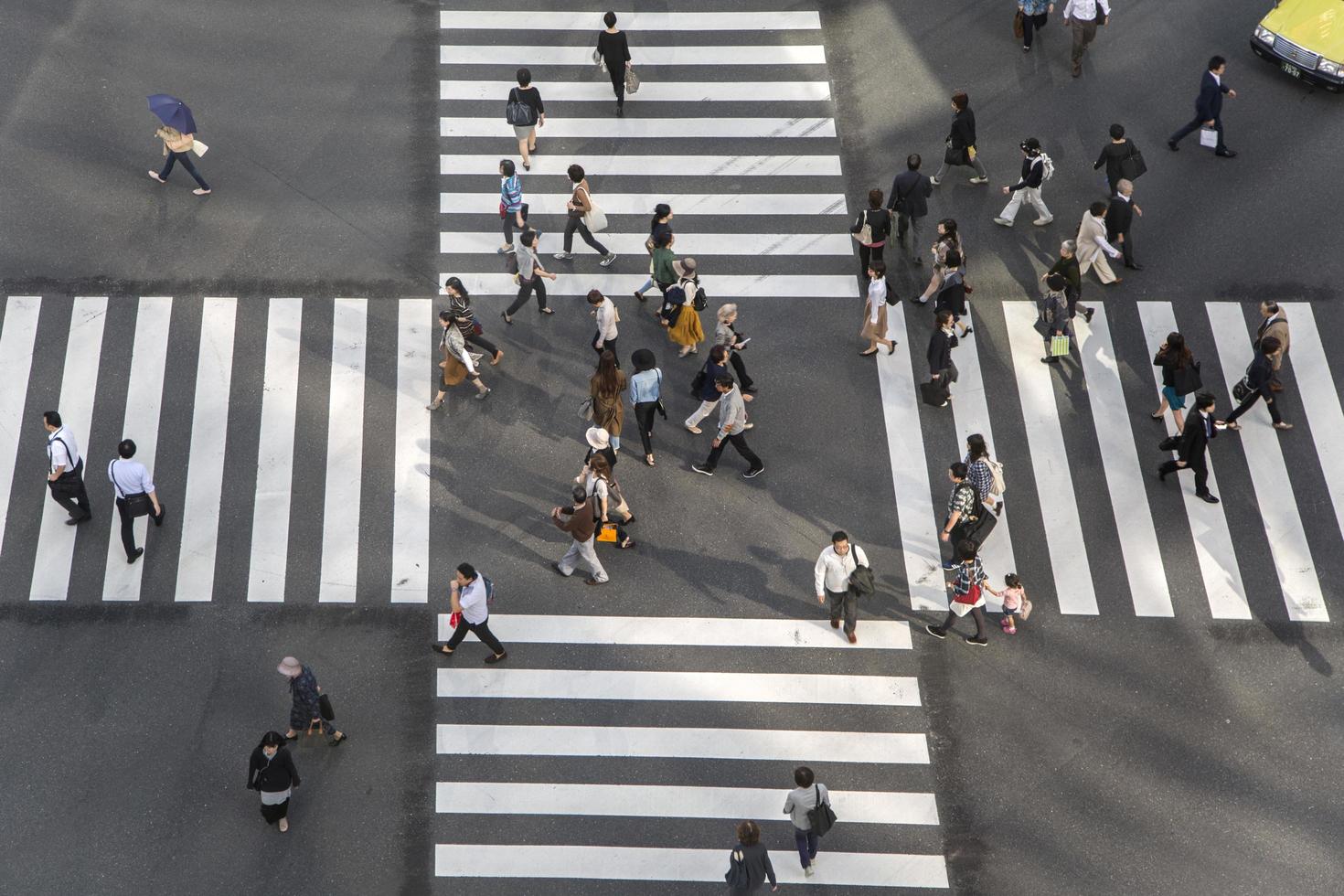 TOKYO, JAPAN, OCTOBER 12, 2016 - Unidentified people crossing the busy street in Ginza, Tokyo.It is a popular upscale shopping area of Tokyo. photo