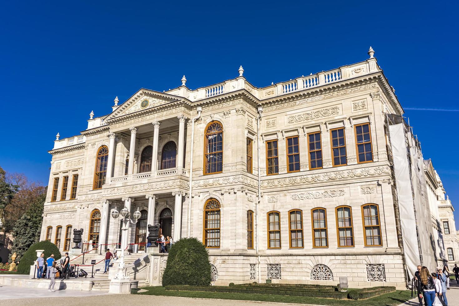 ISTANBUL, TURKEY, NOVEMBER 9, 2019 - Unidentified pepole by Dolmabahce Palace in Istanbul. Palace was built at 1856 and served as main administrative center of the Ottoman Empire until 1922 photo