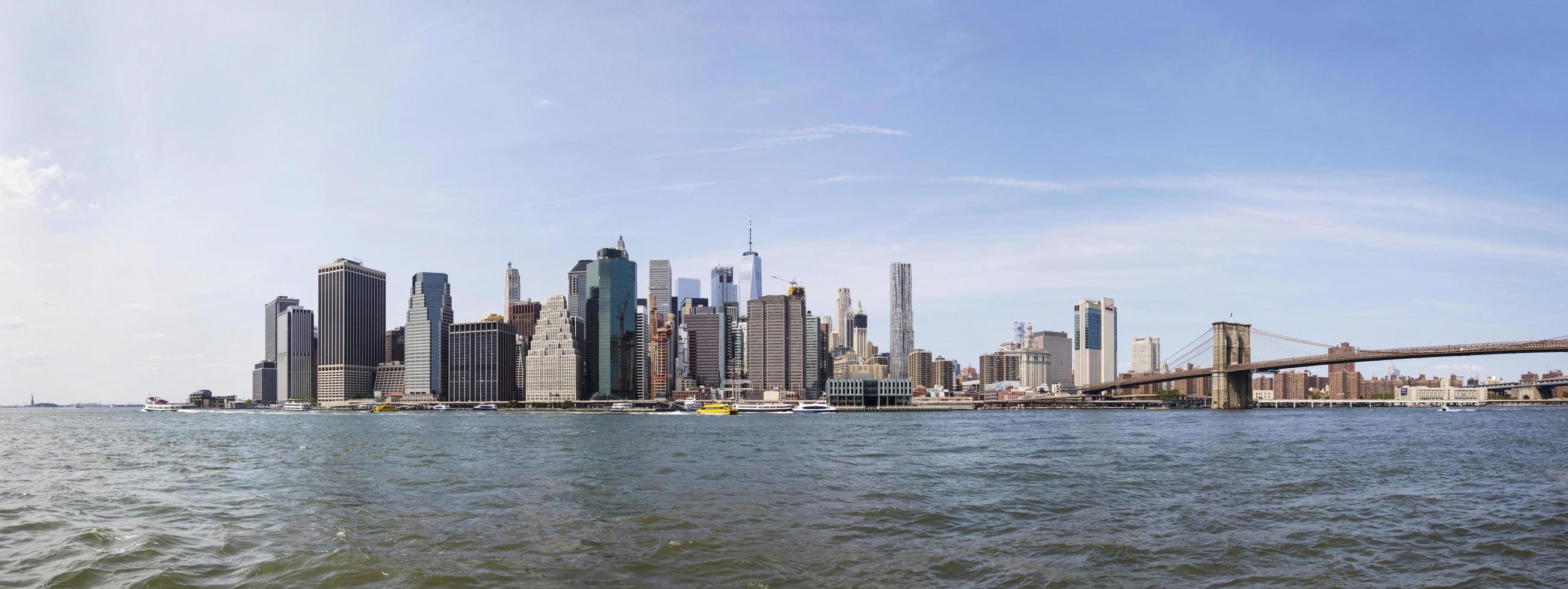 NEW YORK, USA, AUGUST 27, 2017 -  View at Brooklyn bridge in New York. It is a hybrid bridge with approximately 4000 pedestrians and 3000 cyclists cross this historic bridge each day. photo