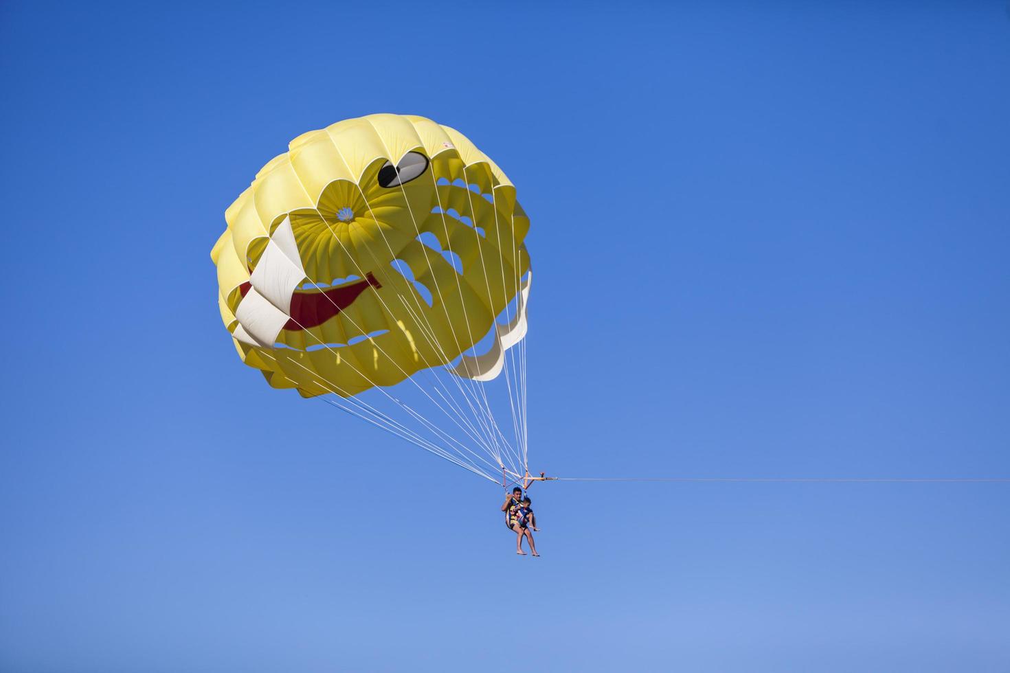 BELDIBI, TURKEY, OCTOBER 7 - Unidentified people parasailing at Beldibi at October 7, 2013. Parasailing is popular on the coastal area of Turkey and almost all main hotels has parasailing activity. photo