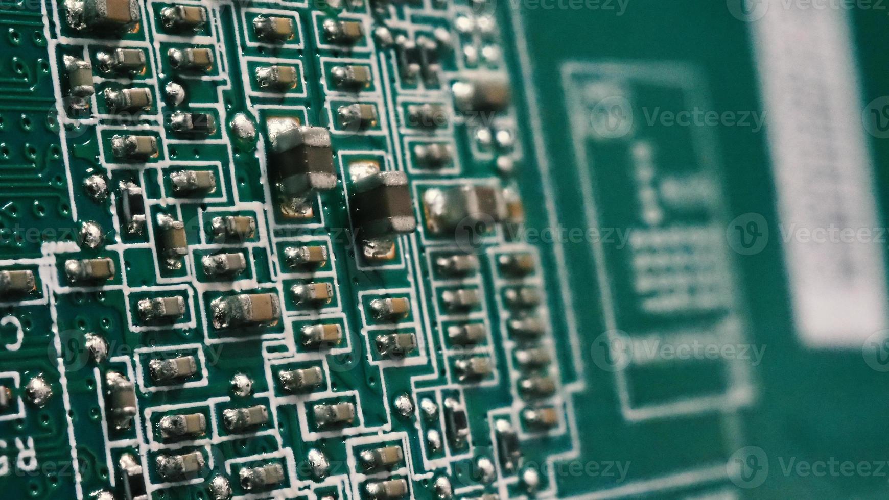 Semiconductor. cpu chip located on the green motherboard of the computer. photo