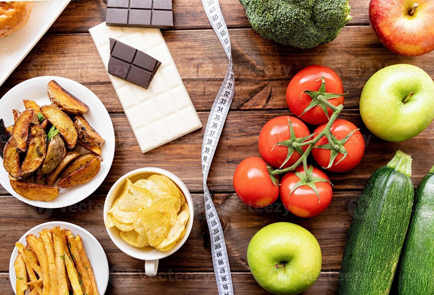 Healthy And Unhealthy Food Concept Fruit And Vegetables Vs Sweets And Potatoe Fries Top View Flat Lay On Wooden Background 3733701 Stock Photo At Vecteezy