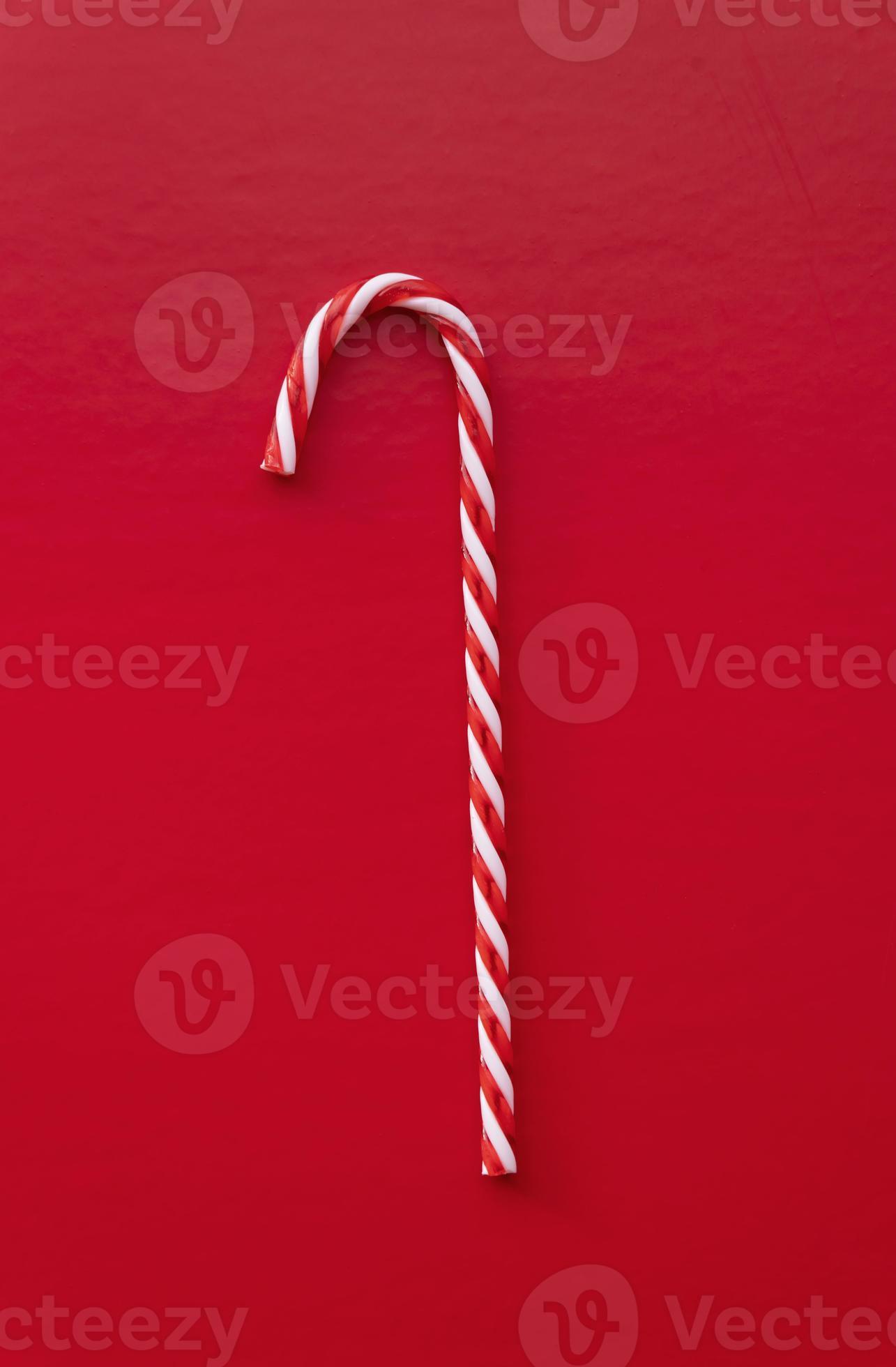 White and red candy cane isolated on red background 3733732 Stock Photo