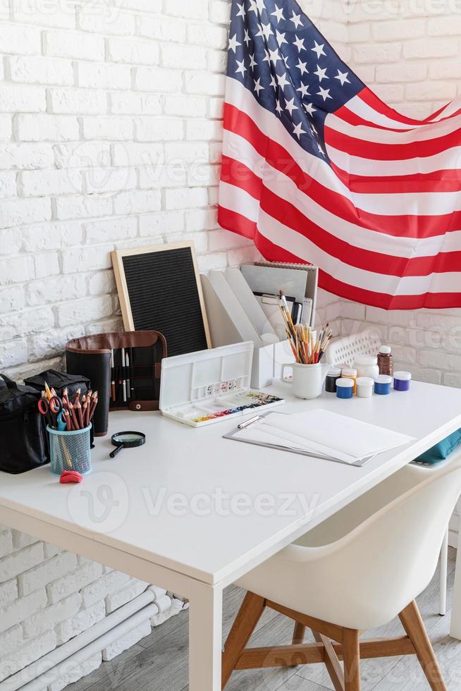 Artist desk and workspace with the US flag photo