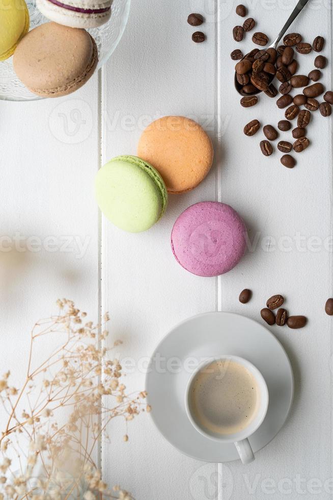 Flat lay macarons on the wooden table photo