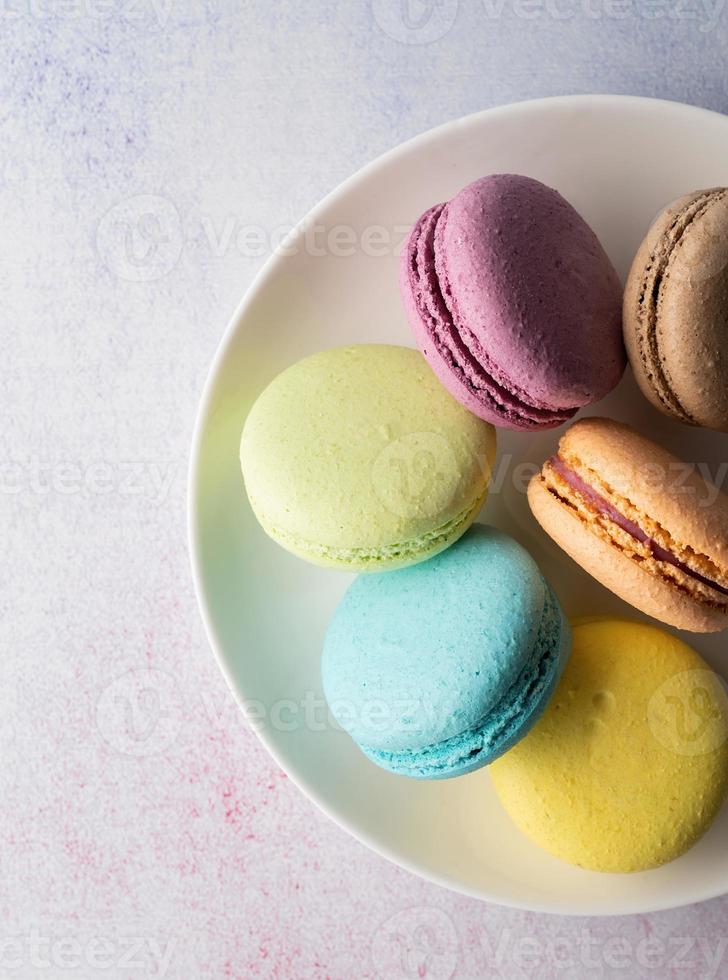 colorful macaroons on the plate photo