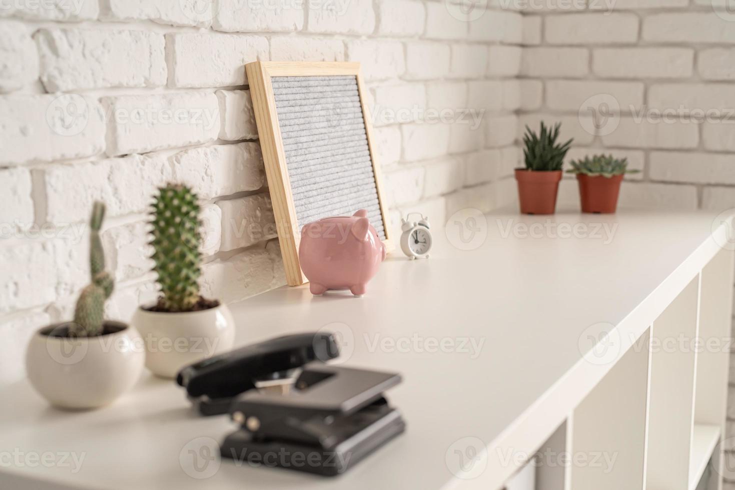 close up of office tools on the white shelf photo