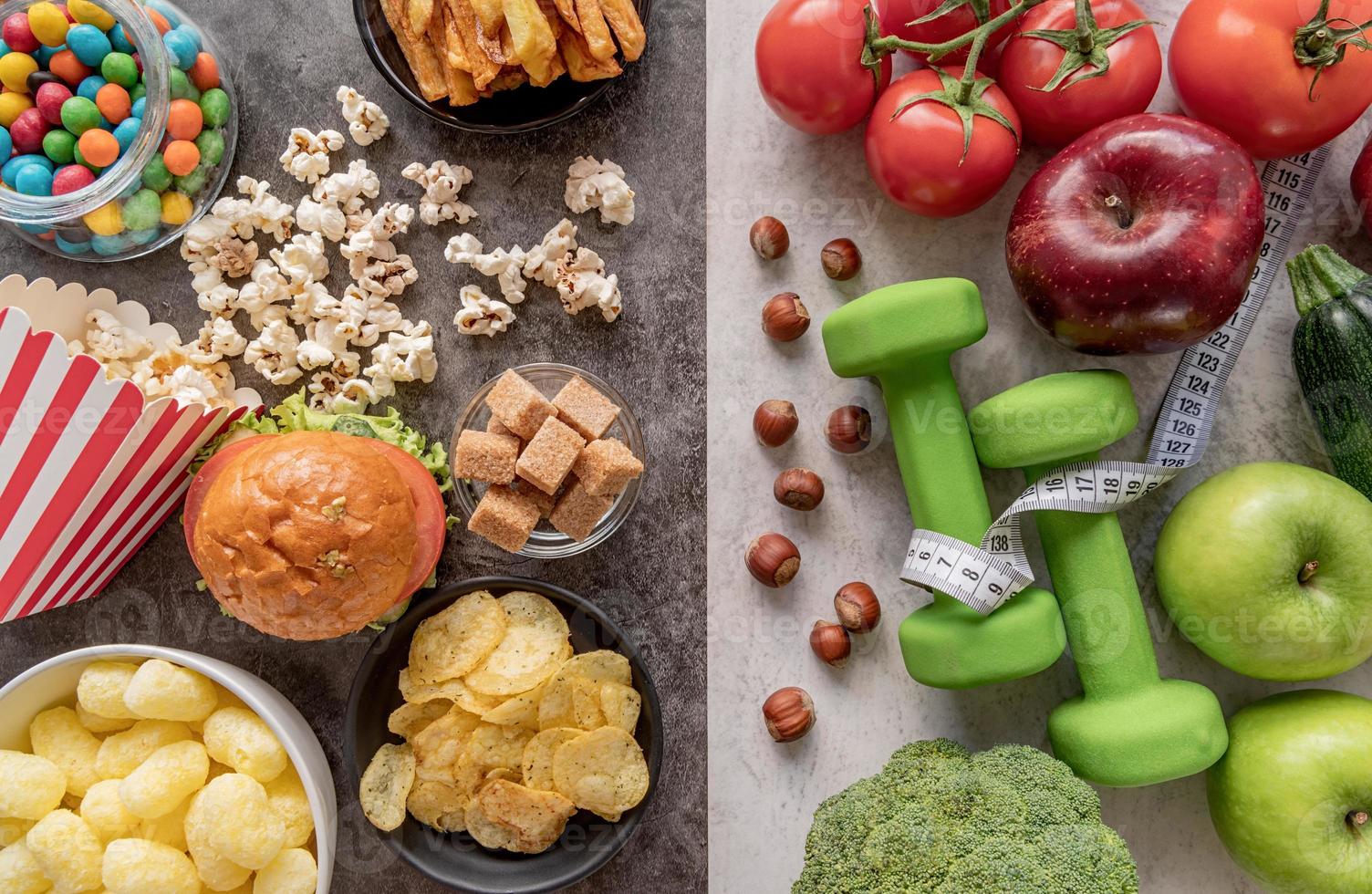Fruit and vegetables vs sweets and potato fries top view flat lay photo