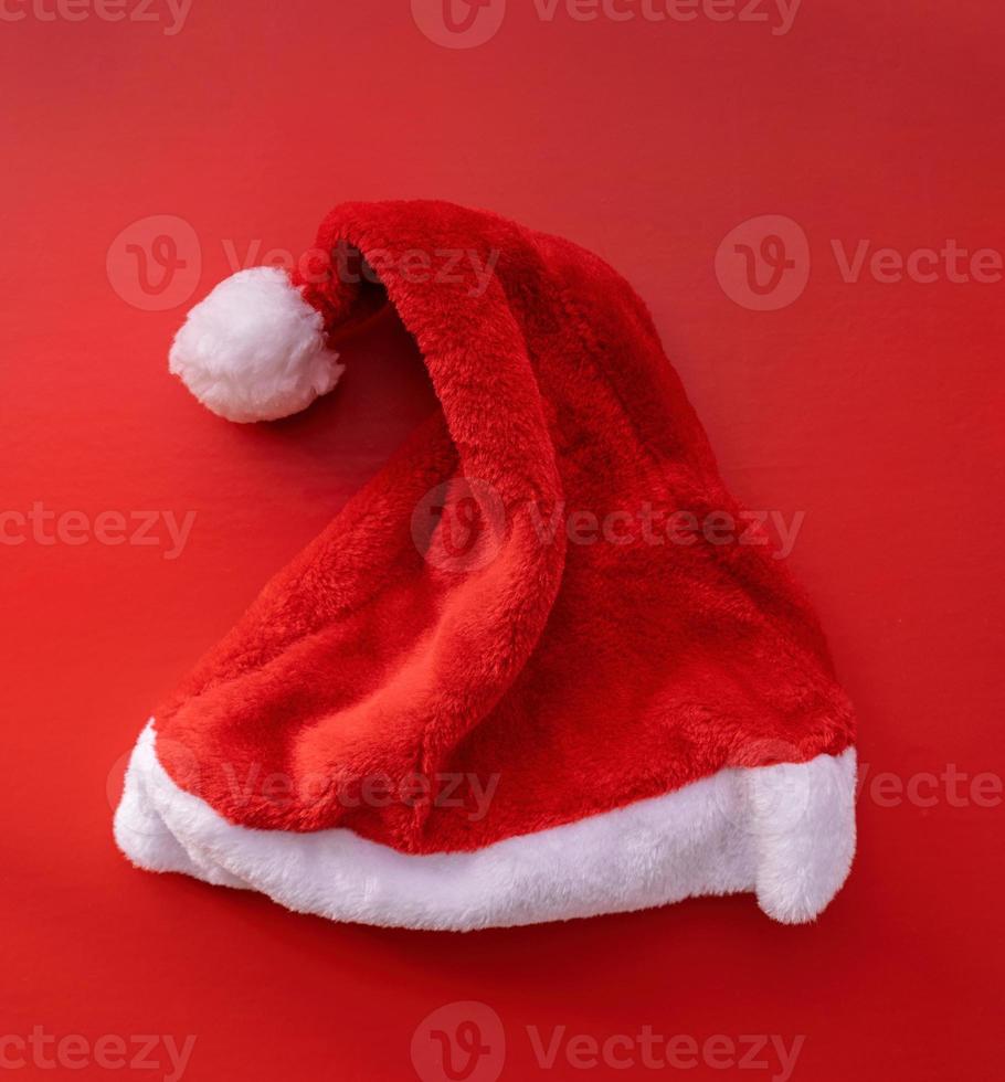 santa hat top view on red background photo