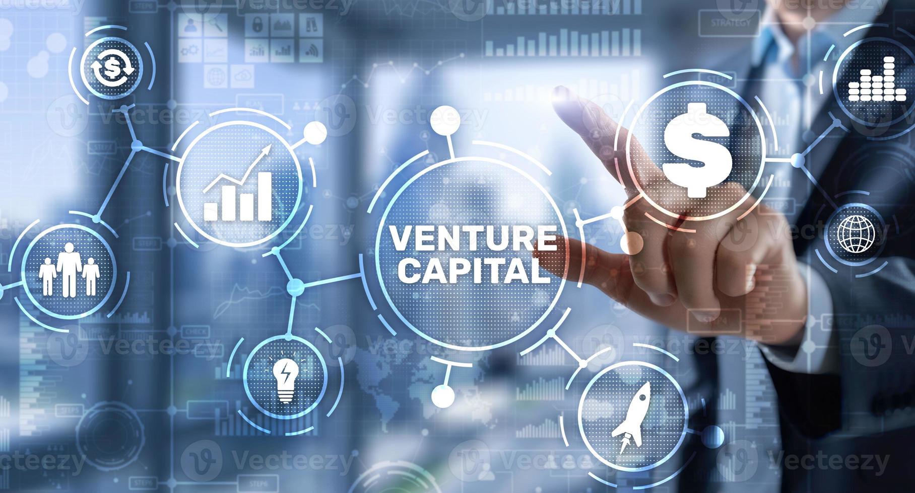 Venture capital. Investor capital. Businessman pressing virtual screen inscription photo