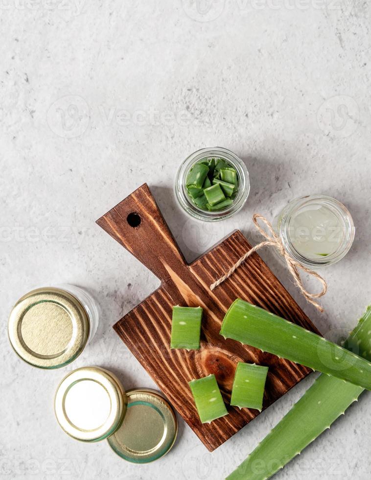 Top view of aloe vera slices on a cutting board with copy space photo