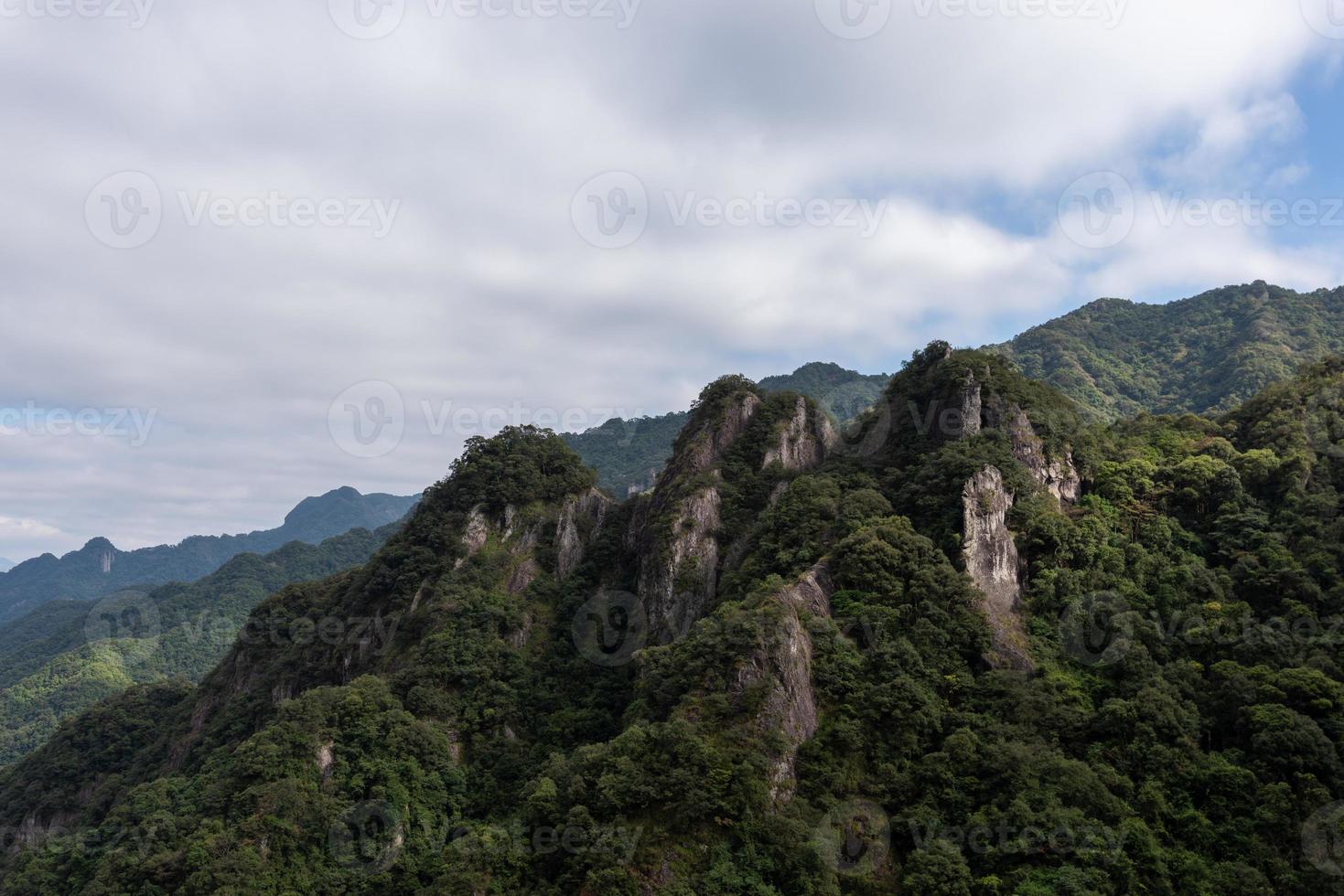 Mountains, rocks and forests on a sunny day photo