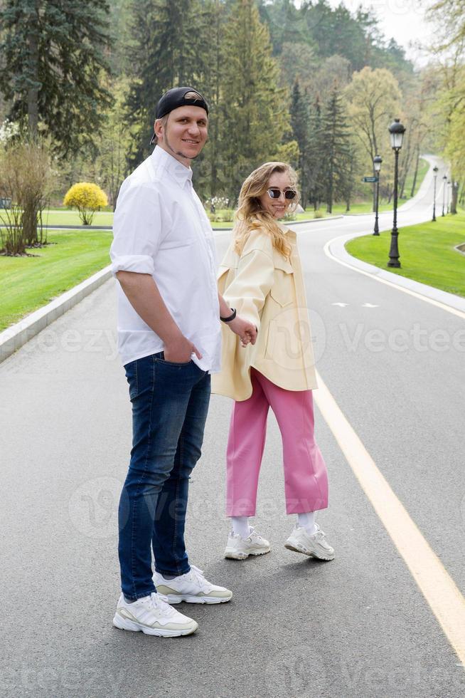 Loving couple holding hands and looking at the camera photo