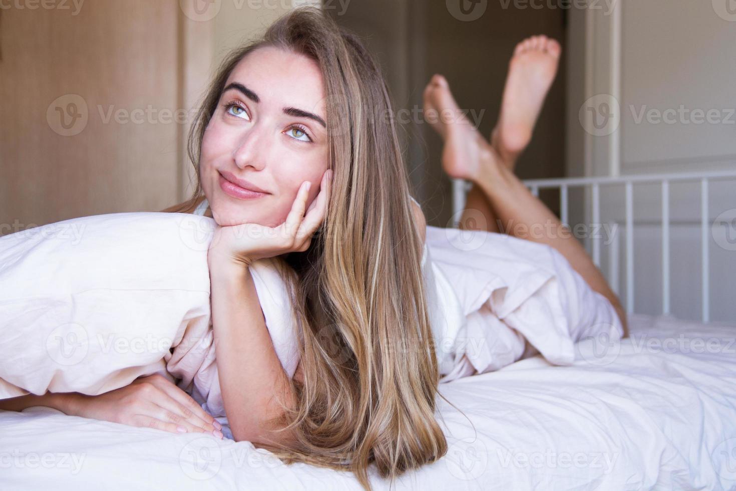 selective focus on face - Pretty white girl dreaming on bed at her room, good female sleep concept, life style photo