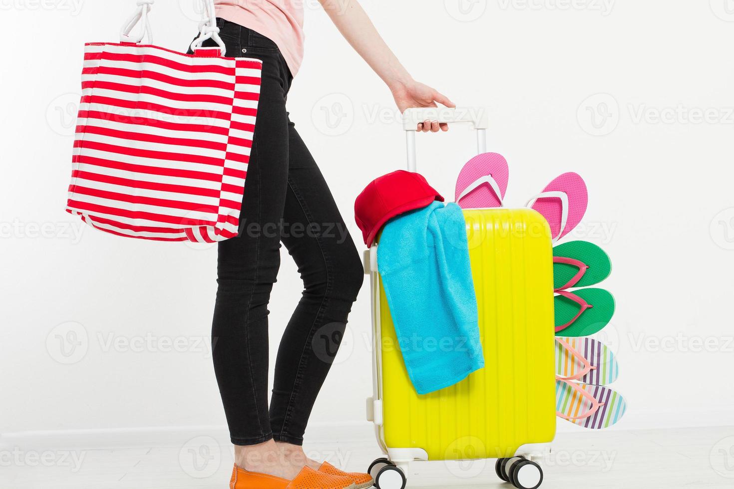 girl with suitcase isolated on white background .Summer holidays. summer flip flops or slippers. Travel valise or bag. Mock up. Copy space. Template. Blank. photo