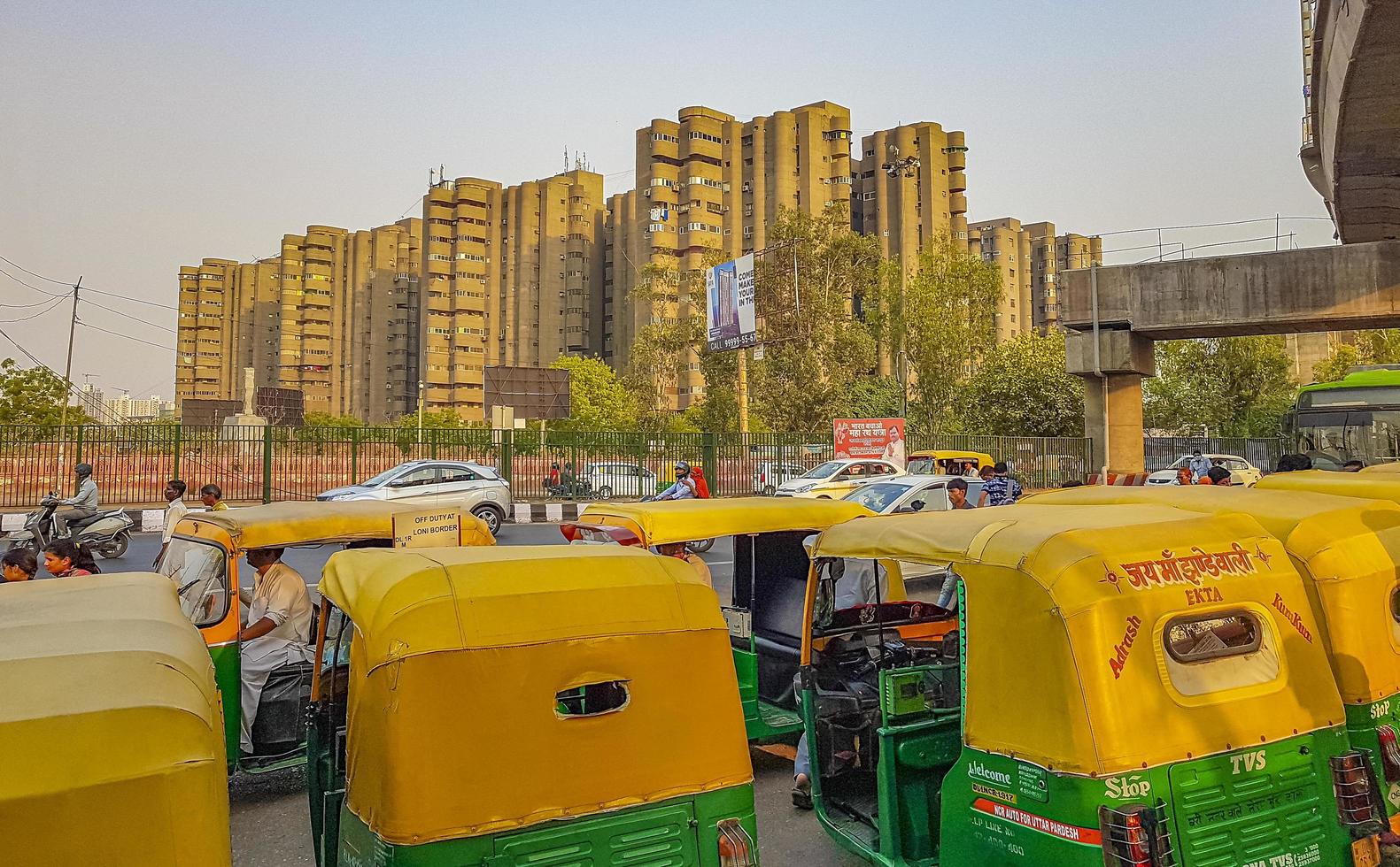 New Delhi Delhi India 2018 - Big traffic Tuk Tuks buses people New-Delhi Delhi India. photo