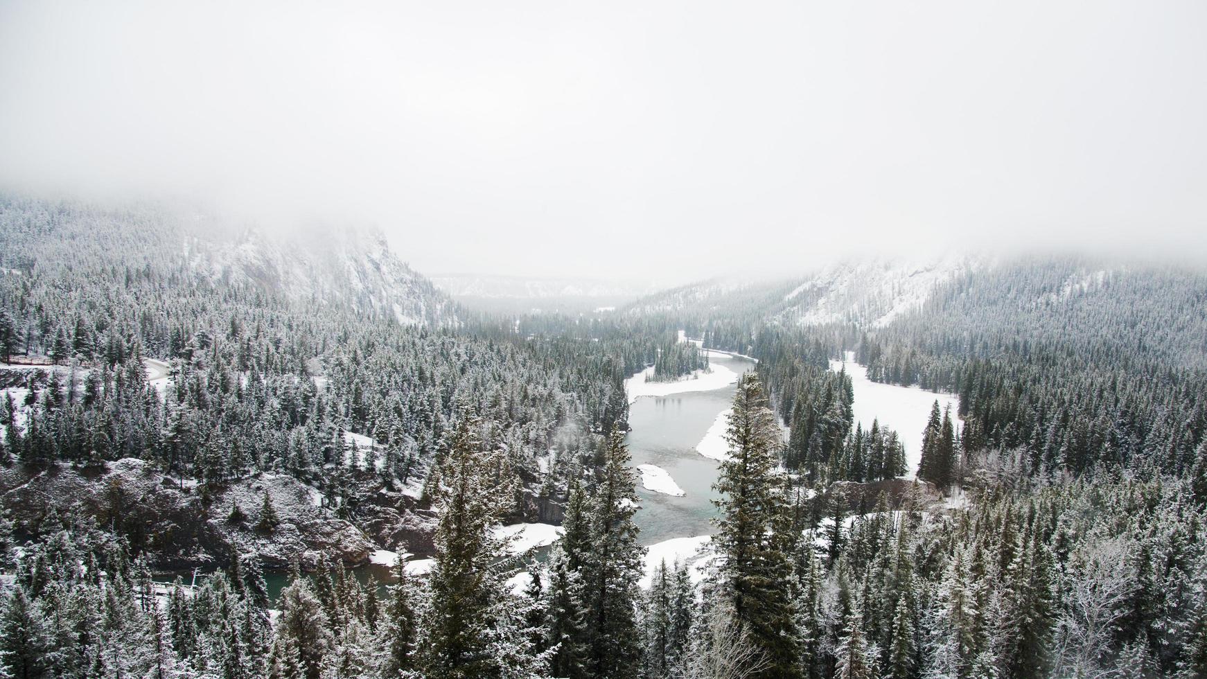 Beautiful canadian landscape in winter with snow, forest and lake. Aerial view of Banff National Park photo