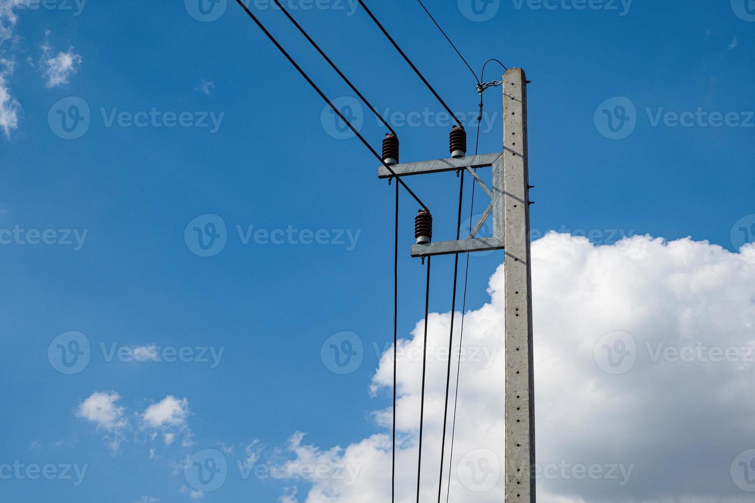 Electricity concrete post and high voltage wire at sky background photo