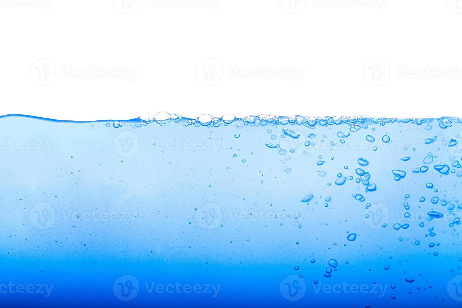 Nivel de agua y burbujas de aire sobre fondo blanco. foto