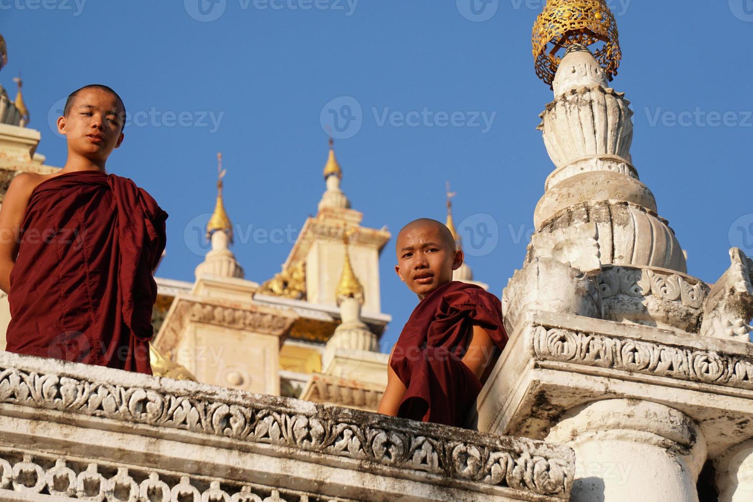 portrait of group of asian novice monk standing at monasery photo