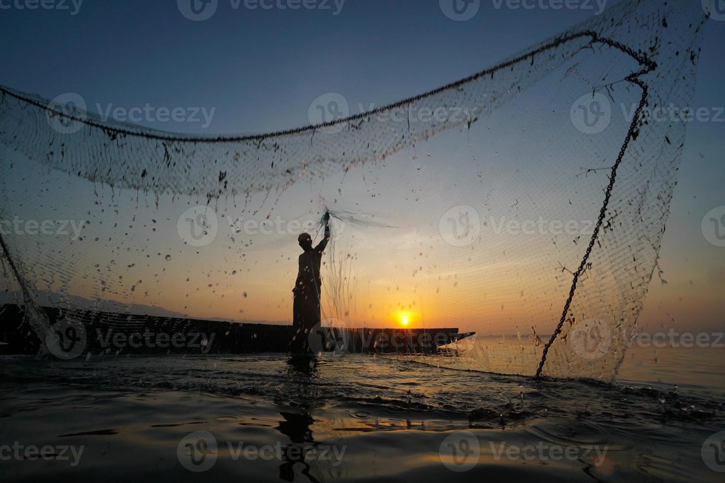 Silhouette of a fisherman photo