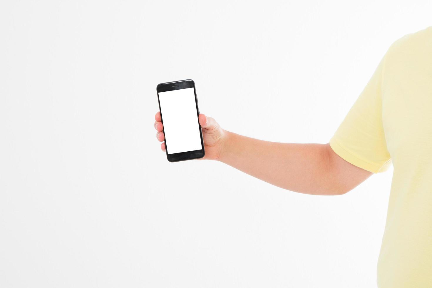 Hand holding black phone isolated on white clipping path inside. Top view.Mock up.Copy space.Template.Blank. photo