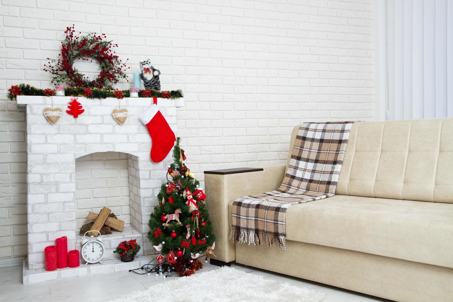 Christmas living room with a christmas tree and fire place presents under it - modern classic style, new year concept photo