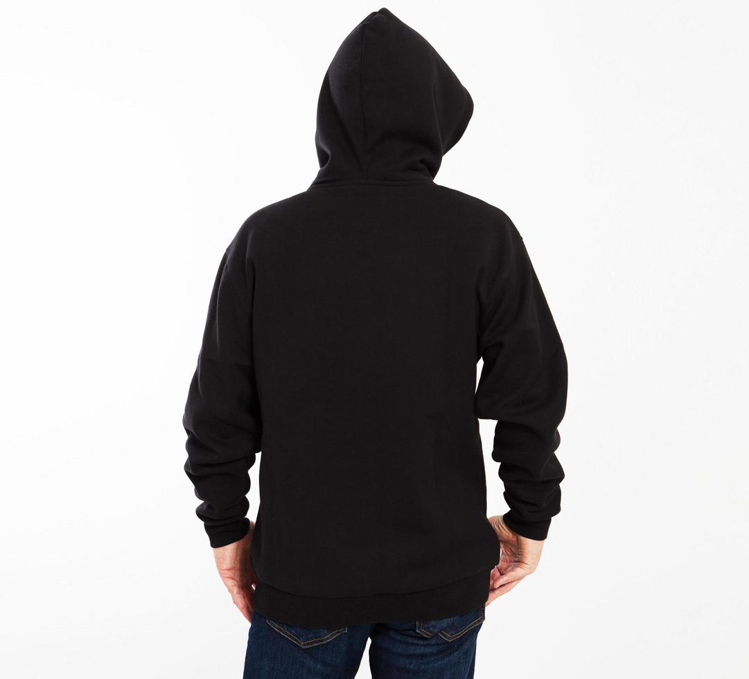 Casual image of caucasian male wearing a black hoodie, photographed in studio. Black sweatshirt mockup photo