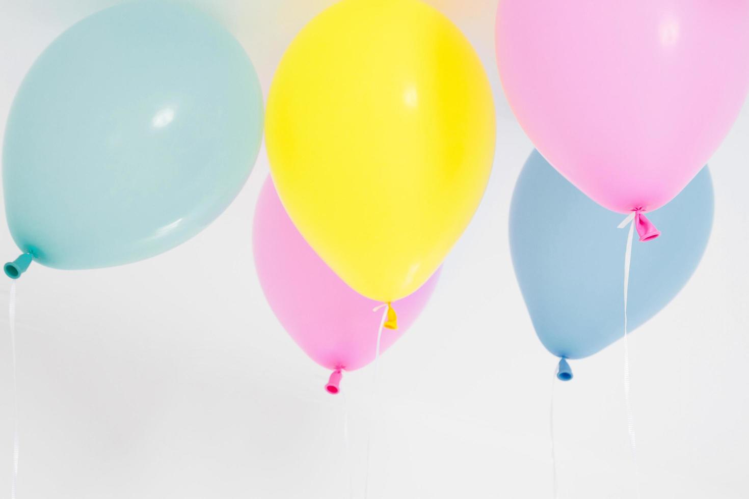 Colorful party balloons background. Isolated on white. Copy space photo